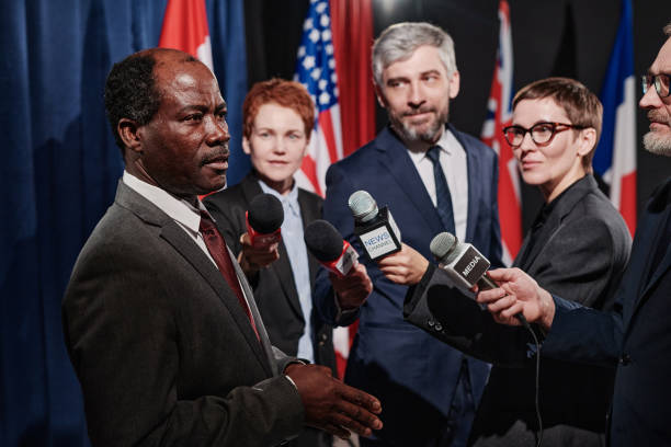 istock Politician giving an interview at conference 1401674204