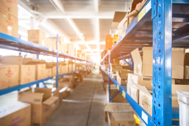 istock Warehouse or storage and shelves with cardboard boxes 1401675606