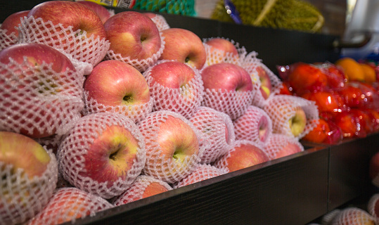 Fruits for sale in the supermarket, apples on the shelves