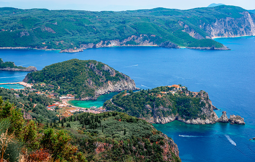 Scenic landscape of the Paleokastritsa era in Corfu, Greece, with crystal clear water and rocky coves. Breathtaking view from Angelokastro.