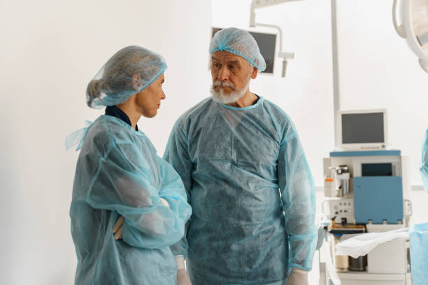 istock Two doctors surgeons are conferring in the operating room before the surgery 1401692126