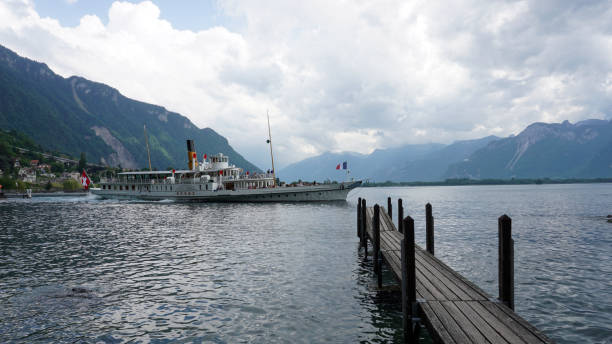 Boat cruise on Lake Geneva near Chateau de Chillon. Canton Vaud, Switzerland - 23 MAY 2022 : Boat cruise on Lake Geneva departed from dock near Chateau de Chillon in Veytaux. chateau de chillon photos stock pictures, royalty-free photos & images