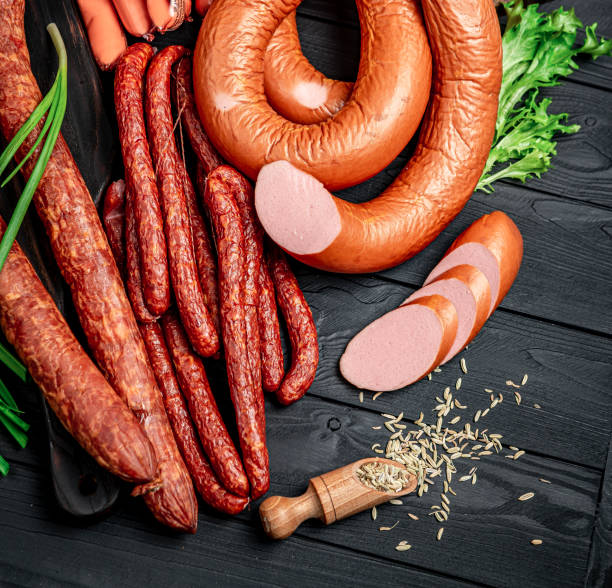 istock Set of different types of smoked sausages. 1401693350