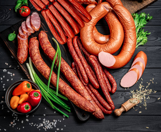 istock Set of different types of smoked sausages. 1401693352