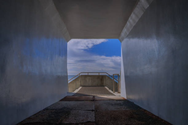 Blue sky and sea beyond the tunnel