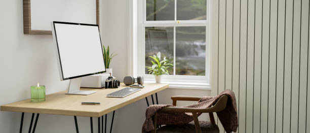 istock Minimal white home workplace with computer on wood table against the white wall 1401695281