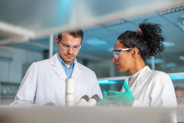 Two Scientists During A Medical Research In A Laboratory stock photo