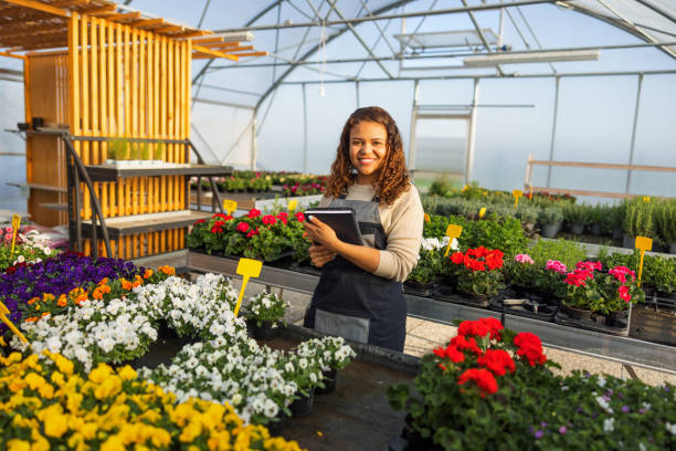 istock Female Environmentalist Using Digital Tablet In Greenhouse 1401699928