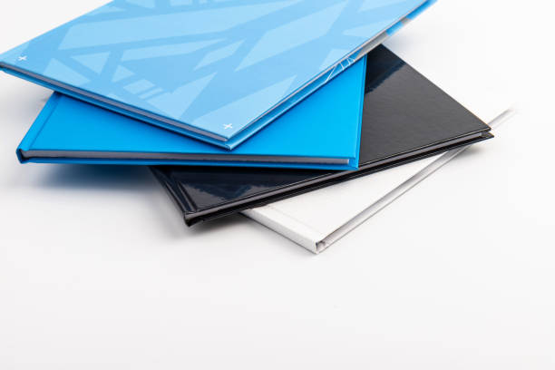 istock Pile of different notebooks isolated on white background 1401700231