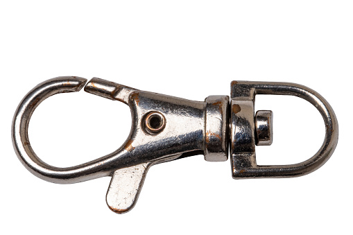 Closeup of a sturdy metal carabiner or snap hook with a rotating eyelet isolated on a white background. Clipping path. Macro.
