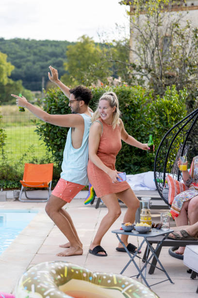 istock Dancing By The Pool With Friends 1401701448