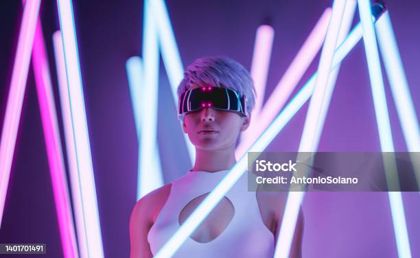 Futuristic Woman In Vr Goggles In Neon Studio With Illuminated Sticks Stock Photo - Download Image Now