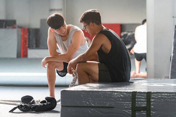 istock Muscular Asian Men Chatting Interacting 1401709287