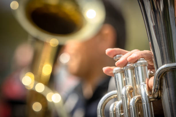 Tuba players Hamburg, Germany - May 01, 2022: Tuba players on the street of Hamburg brass horn stock pictures, royalty-free photos & images