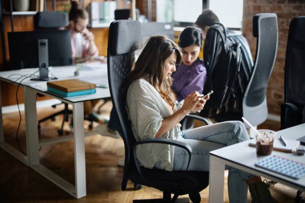 istock Multi-ethnic coworkers discussing in office 1401713046