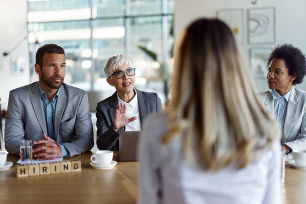 istock Human resource team having a job interview with their candidate in the office. 1401713444