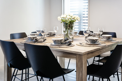 Modern Scandinavian family table setting. Cozy home concept.