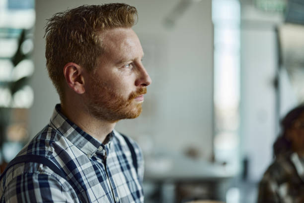 istock Profile view of a redhead man. 1401715048
