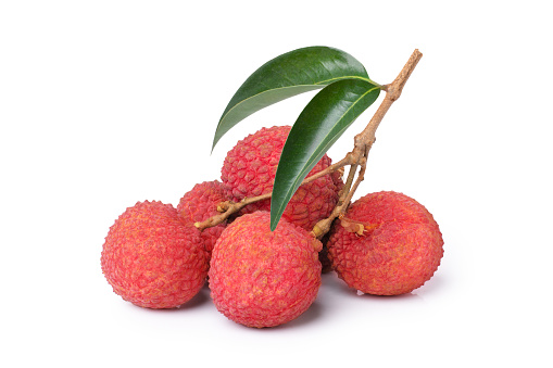 Closeup branch of fresh lychee with green leaf isolated on white background.