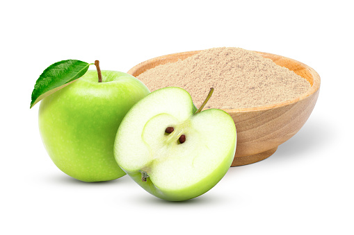 Apple pectin fiber powder in wooden bowl and fresh green apple with cut in half slice isolated on white background.