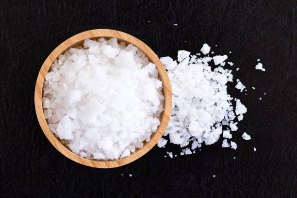 istock Sea salt in wooden bowl 1401719929