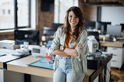 Portrait of confident female entrepreneur at creative office