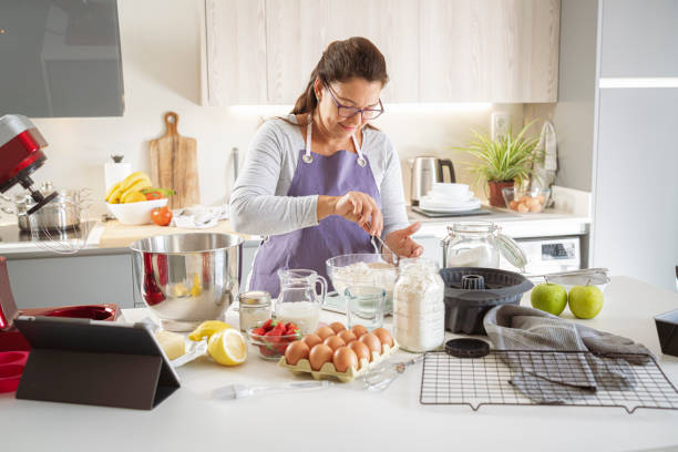 istock Woman mixing ingredients to make cake 1401722119