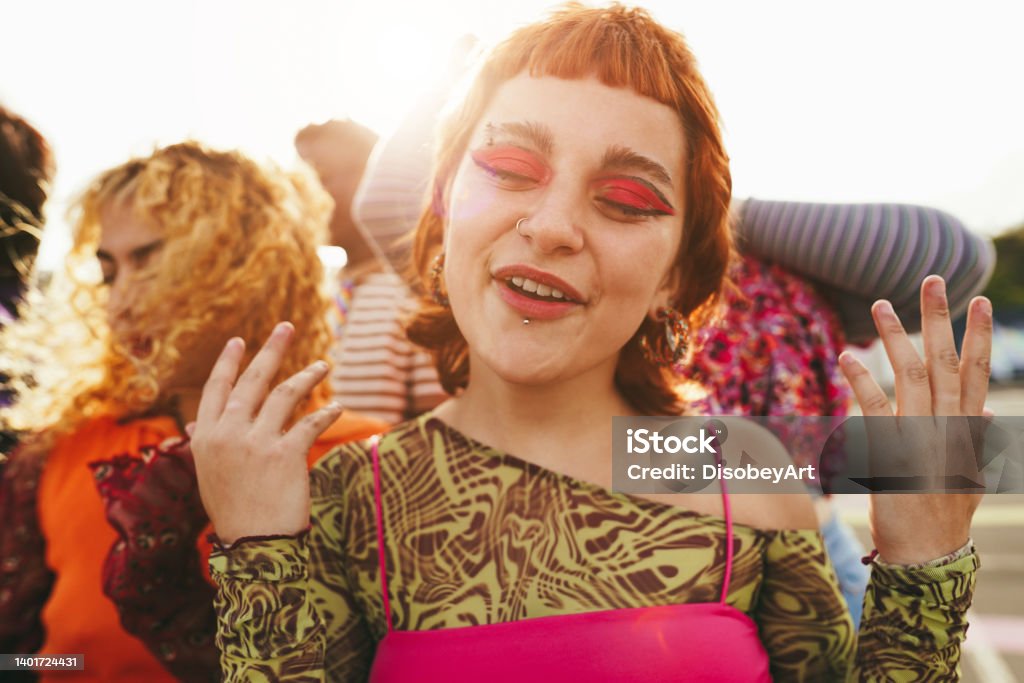 Young diverse people having fun outdoor laughing together - Soft focus on girl nose Generation Z Stock Photo