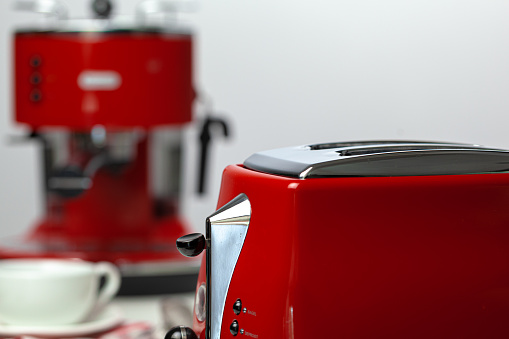 Close up of modern red kitchen .appliances on kitchen table