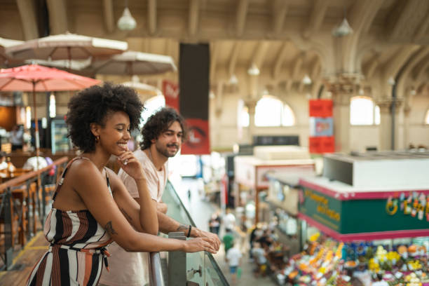 Couple at the municipal market Couple at the municipal market in São Paulo, Brazil market hall stock pictures, royalty-free photos & images