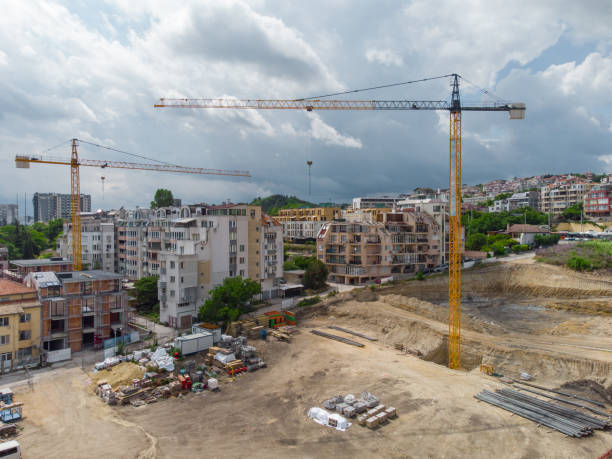 istock Busy Construction Site and Construction Equipment Aerial view 1401729029