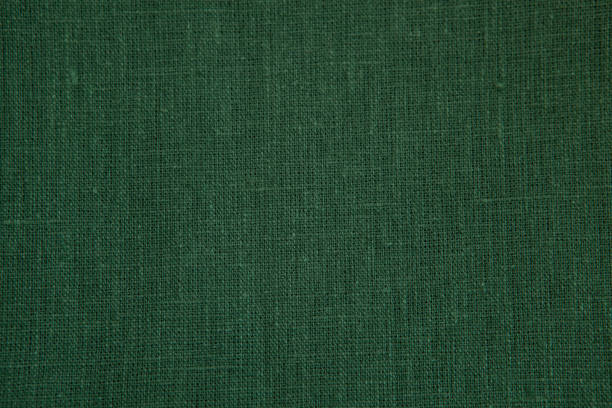 istock Textured background from natural linen fabric, green colour. 1401729256