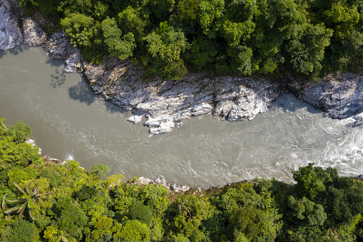 Aerial top view of a beautiful mountain river with a granite rockbed