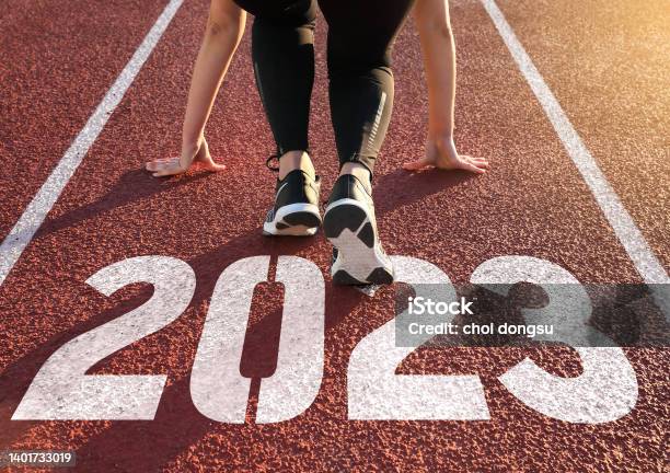 Athletics Track Engraved With The Year 2023 Stock Photo - Download Image Now - 2023, Starting Line, Running