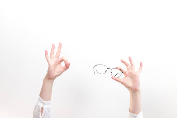 istock glasses and Okey sign on a white background 1401735192