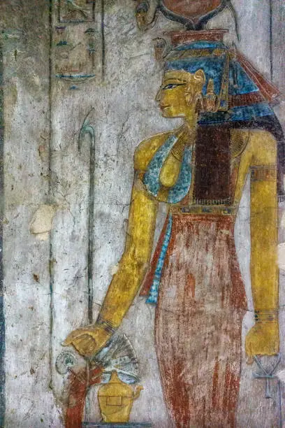 Ancient egypt color image of Egyptian Queen Cleopatra on wall of temple