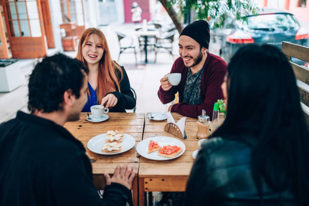 istock Friends having breakfast outdoors 1401736573