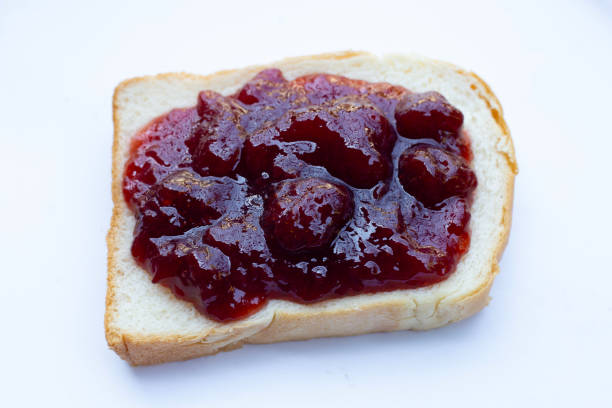 istock Bread with strawberry jam on white background 1401737561