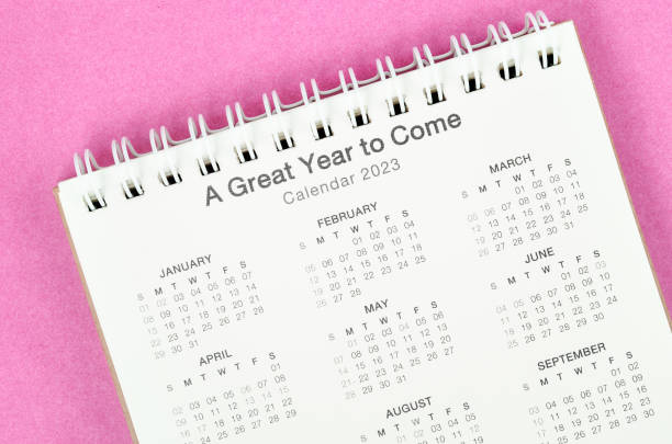 istock 12 months desk calendar 2023 on pink background. 1401739622