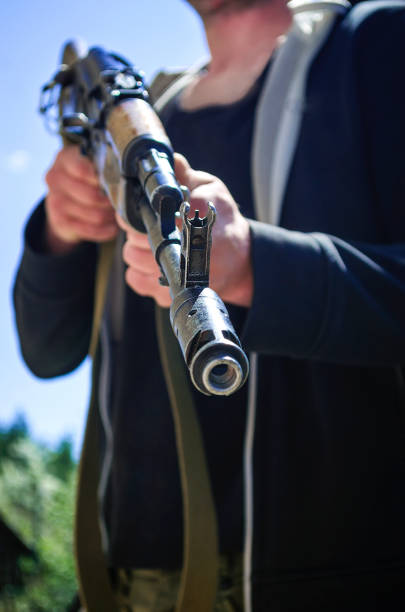 istock At gunpoint. A man with a weapon. Ukraine 1401740775