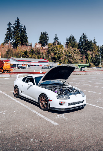 Seattle, WA, USA\nJune 4, 2022\nMK4 Supra in a parking lot with the hood open