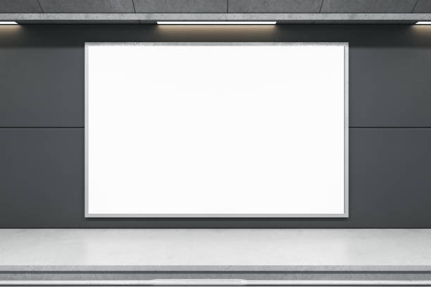istock Front view on blank white banner with place for your logo or text in empty subway area with light grey floor and rails. 3D rendering, mock up 1401741370