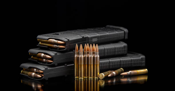 istock Bullet isolated on black background with reflexion. Rifle bullets close-up on black back. Cartridges for rifle and carbine on a black. 1401741776