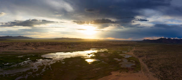 istock Sand dunes Bayan Gobi and lake at sunset 1401742619