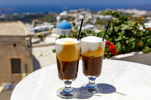 Two glasses of frappe cold coffee on Santorini island in Greece.