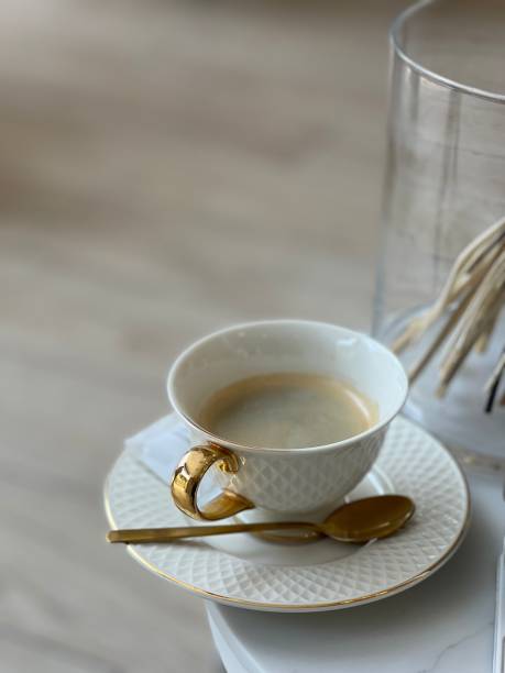 istock cup of coffee and golden spoon 1401742753