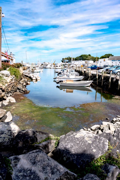 istock Small boats lining waterfront in Wickford Cove rhode island 1401744173