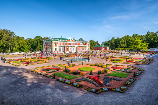 Saint Petersburg, Russia - July 9, 2013: Tourists walk near Petrodvoretz (Peter I Palace) and Grand Cascade Fountain in the Saint Petersburg.