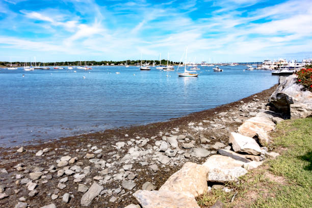 istock Small boats lining waterfront in Wickford Cove rhode island 1401746231