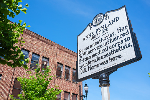 Asheville, North Carolina USA - May 5, 2022: Sign commemorating Anne Penland in the downtown urban district of this popular small town visitor destination in the Blue Ridge mountains.